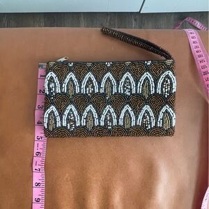 Elegant Black and White Wristlet with Beaded Pattern